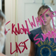 Madison Iseman stares as a message reading "I know what you did last summer" scrawled in lipstick on her mirror.